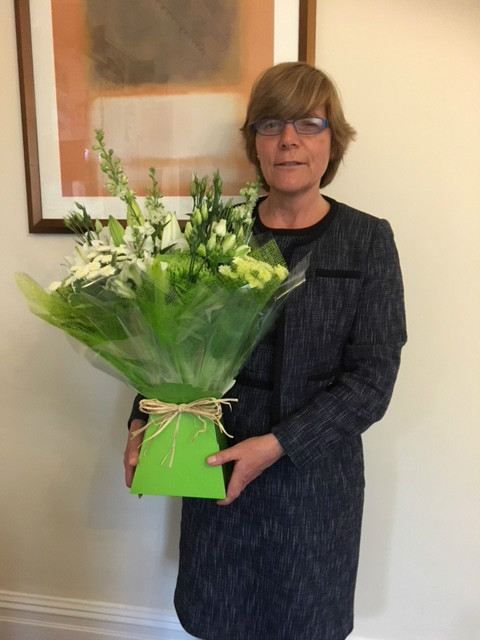 Sheldon receives lovely flowers from a very happy client! 